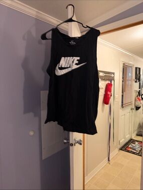 Nike men’s Black Sleeveless Tank with White Swoosh Logo